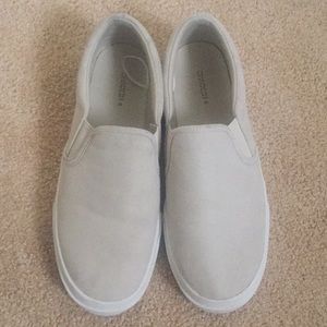 Cream-colored slip on casual sneakers